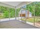 Screened porch overlooking backyard and detached garage at 2841 Auldreeke Rd, Johns Island, SC 29455