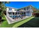 Large backyard with pool, putting green, and plenty of seating at 3 43Rd Ave, Isle of Palms, SC 29451