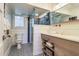 Bathroom with a walk-in shower, white subway tile, and wood vanity at 3 43Rd Ave, Isle of Palms, SC 29451