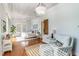 Bright bedroom with hardwood floors and a comfy sitting area at 3 43Rd Ave, Isle of Palms, SC 29451