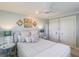 Bedroom with a queen bed, light blue bedding, and coastal decor at 3 43Rd Ave, Isle of Palms, SC 29451