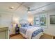 Serene bedroom with a queen bed, blue and white bedding, and window seat at 3 43Rd Ave, Isle of Palms, SC 29451
