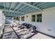 Relaxing covered patio with outdoor furniture at 3 43Rd Ave, Isle of Palms, SC 29451