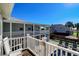 Home's exterior showcasing upper deck, backyard, and pool at 3 43Rd Ave, Isle of Palms, SC 29451