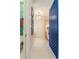 Hallway with blue barn door and light flooring at 3 43Rd Ave, Isle of Palms, SC 29451