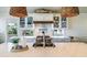 Bright kitchen with white cabinets, quartz countertops, and a farmhouse sink at 3 43Rd Ave, Isle of Palms, SC 29451