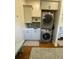 Stackable washer and dryer with additional storage and countertop space at 3 43Rd Ave, Isle of Palms, SC 29451