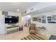 Living area with a large TV, comfortable seating, and staircase view at 3 43Rd Ave, Isle of Palms, SC 29451