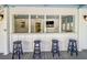 Covered outdoor bar with four stools, perfect for casual gatherings at 3 43Rd Ave, Isle of Palms, SC 29451