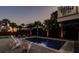 Tranquil nighttime pool scene with surrounding patio at 3 43Rd Ave, Isle of Palms, SC 29451