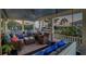 Spacious covered porch with seating area, swing, and ocean views at 3 43Rd Ave, Isle of Palms, SC 29451