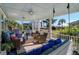 Large covered porch with comfortable seating, swing, and ocean views at 3 43Rd Ave, Isle of Palms, SC 29451