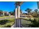 View from the porch overlooking a residential street and some ocean at 3 43Rd Ave, Isle of Palms, SC 29451