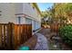 Landscaped side yard with path and wooden fence at 3 43Rd Ave, Isle of Palms, SC 29451