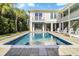 Relaxing pool area with spacious patio and home view at 3 43Rd Ave, Isle of Palms, SC 29451