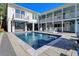 Inviting swimming pool with surrounding patio and lounge chairs at 3 43Rd Ave, Isle of Palms, SC 29451