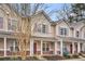 Tan townhouses with purple shutters and brick accents at 304 Twin Tree Dr, Summerville, SC 29485