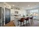 Modern kitchen with white cabinets, granite island, and stainless steel appliances at 307 Black Birch Dr, Summerville, SC 29486