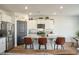 Modern kitchen features white cabinets, granite counters, and island seating at 307 Black Birch Dr, Summerville, SC 29486