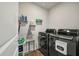 Functional laundry room with washer, dryer, and shelving at 307 Black Birch Dr, Summerville, SC 29486