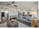 Open living room and kitchen with gray couch, and ceiling fan at 307 Black Birch Dr, Summerville, SC 29486