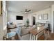 Open concept living room with hardwood floors, gray couch, and TV at 307 Black Birch Dr, Summerville, SC 29486