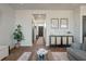 Living room with hardwood floors, gray couch, and access to entryway at 307 Black Birch Dr, Summerville, SC 29486