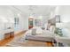 Bright and airy bedroom with a king-size bed and hardwood floors at 31 Frogmore Rd, Mount Pleasant, SC 29464