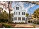 Charming white three-story home with dark green shutters and a spacious driveway at 31 Frogmore Rd, Mount Pleasant, SC 29464