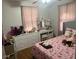Comfortable bedroom with pink accents, ample storage, and natural light at 310 Adeline Dr, Goose Creek, SC 29445