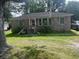 Charming brick home with a front porch and cozy curb appeal at 310 Adeline Dr, Goose Creek, SC 29445