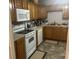 Functional kitchen with appliances, tile floors, and cabinet storage at 310 Adeline Dr, Goose Creek, SC 29445