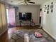 Cozy living room with hardwood floors, a large TV, and stylish decor at 310 Adeline Dr, Goose Creek, SC 29445
