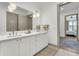 Double vanity bathroom with a view into a bedroom at 320 Longshore Street St # 1044, Charleston, SC 29492