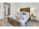 Bright bedroom with wooden bed frame and neutral color scheme at 320 Longshore Street St # 1044, Charleston, SC 29492
