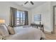 Cozy bedroom with large window, ceiling fan and city view at 320 Longshore Street St # 1044, Charleston, SC 29492