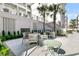 Community patio with tables and chairs at 320 Longshore Street St # 1044, Charleston, SC 29492