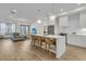 Open concept kitchen features white cabinets, quartz countertops, and stainless steel appliances at 320 Longshore Street St # 1044, Charleston, SC 29492