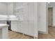 White kitchen with ample storage and a farmhouse sink at 320 Longshore Street St # 1044, Charleston, SC 29492