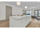 White kitchen island with quartz countertop, perfect for casual dining at 320 Longshore Street St # 1044, Charleston, SC 29492