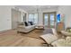 Spacious living room with light floors and access to balcony at 320 Longshore Street St # 1044, Charleston, SC 29492