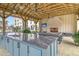 Outdoor kitchen with granite countertop and fireplace at 320 Longshore Street St # 1044, Charleston, SC 29492