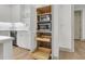 Well-organized pantry with pull-out shelves and built-in microwave at 320 Longshore Street St # 1044, Charleston, SC 29492