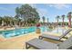 Resort-style pool with lounge chairs and palm trees at 320 Longshore Street St # 1044, Charleston, SC 29492