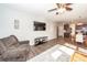 Living room with hardwood floors and a view into the kitchen at 335 Bradley Bend Dr, Moncks Corner, SC 29461