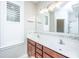 Double vanity bathroom with mosaic tile and updated light fixtures at 4240 William E Murray Blvd, Charleston, SC 29414