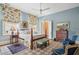 Light blue bedroom with a four-poster bed and sitting area at 43 Hasell St, Charleston, SC 29401