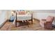 Cozy bedroom with antique bed and patterned rug at 43 Hasell St, Charleston, SC 29401