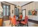 Formal dining room with an oval table, chandelier, and French doors at 43 Hasell St, Charleston, SC 29401