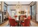 Formal dining room with an oval table, chandelier, and French doors at 43 Hasell St, Charleston, SC 29401